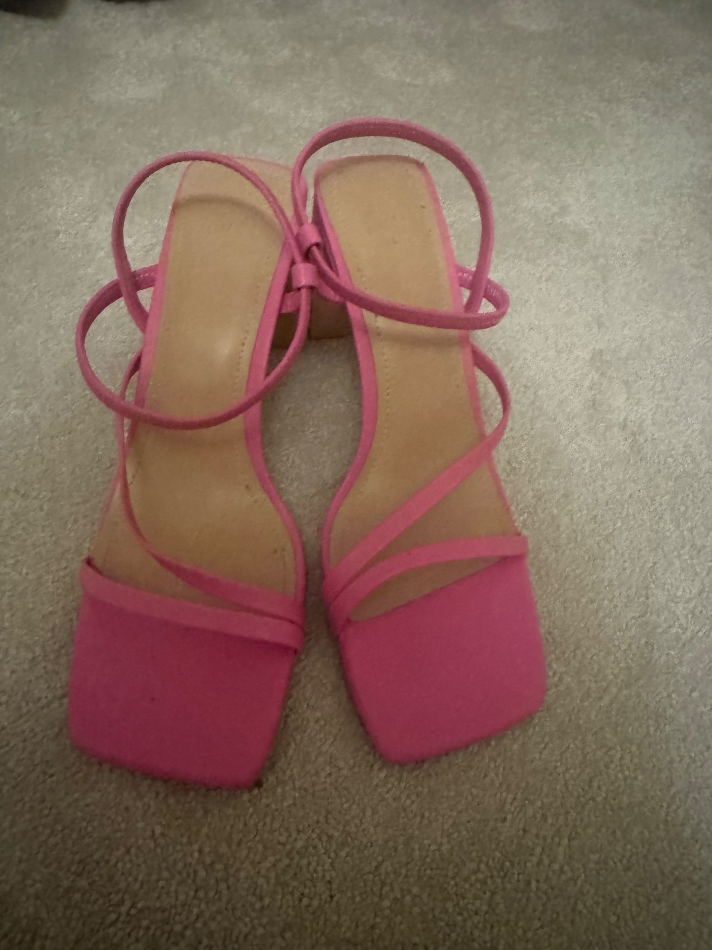 Bright pink strappy shoes